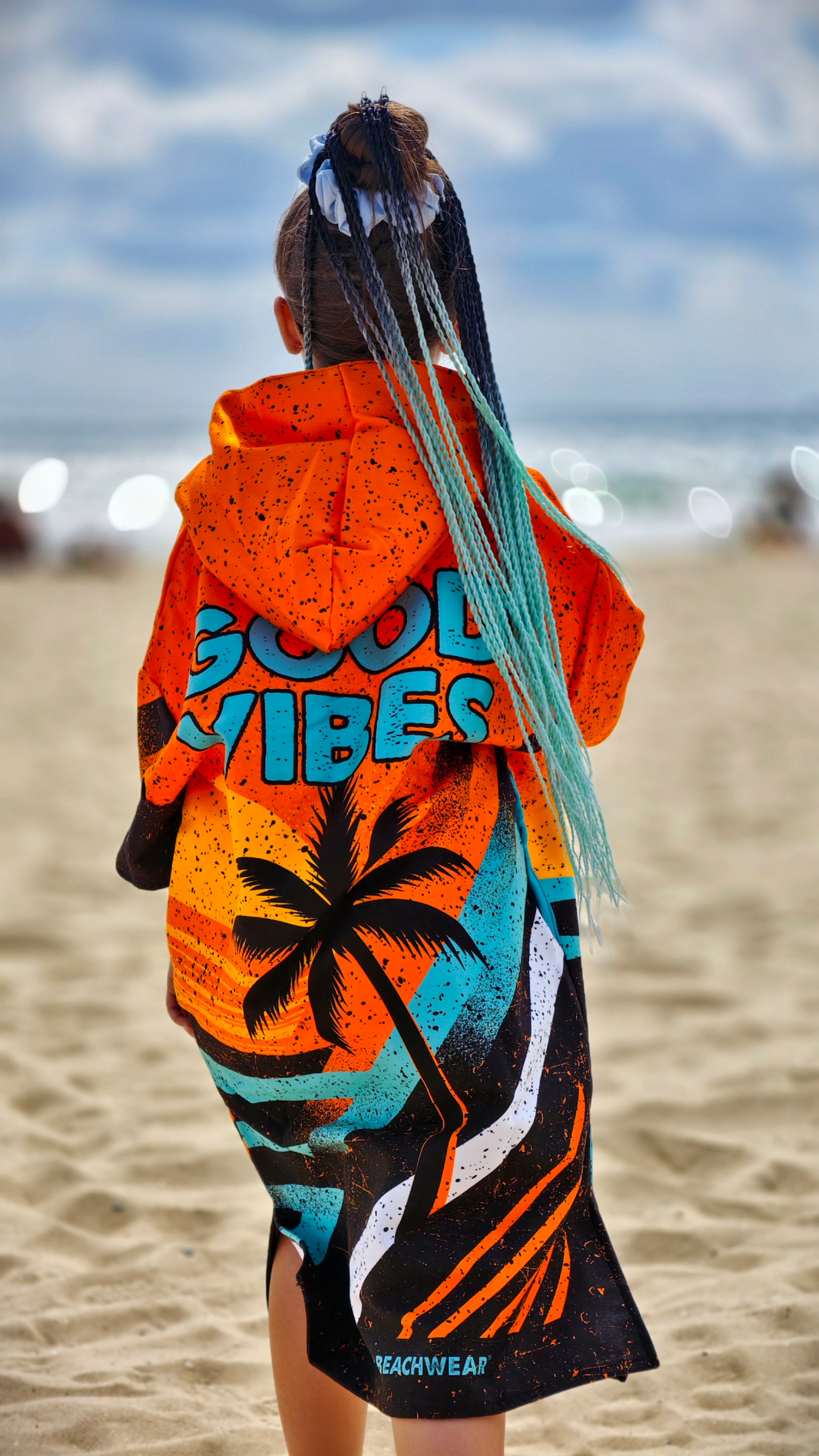 Orange children’s beach poncho towel for girls with hood, zipper and pockets – CACAO Beachwear™