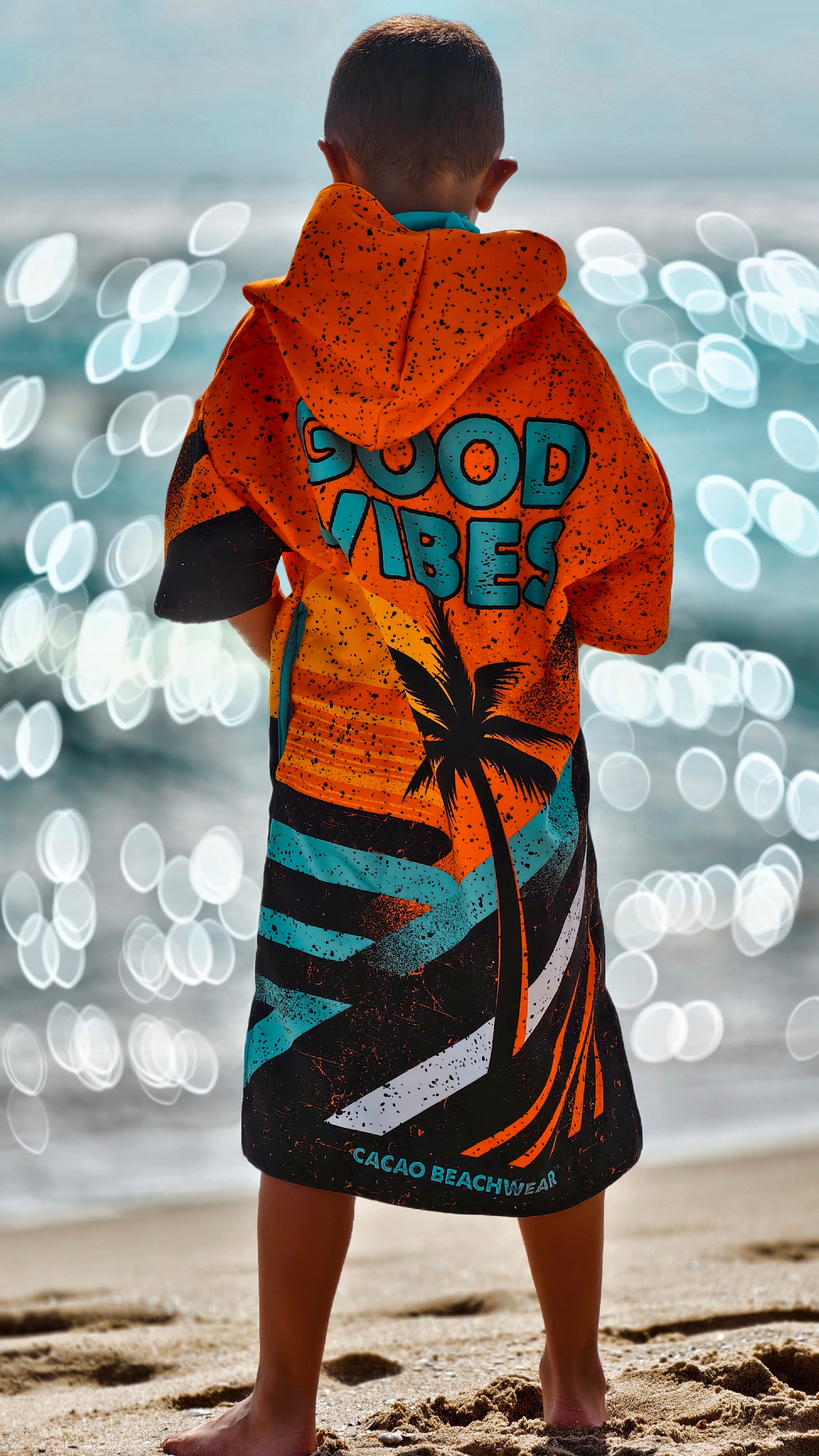 Orange children’s beach poncho towel for boys with hood, zipper and pockets – CACAO Beachwear™