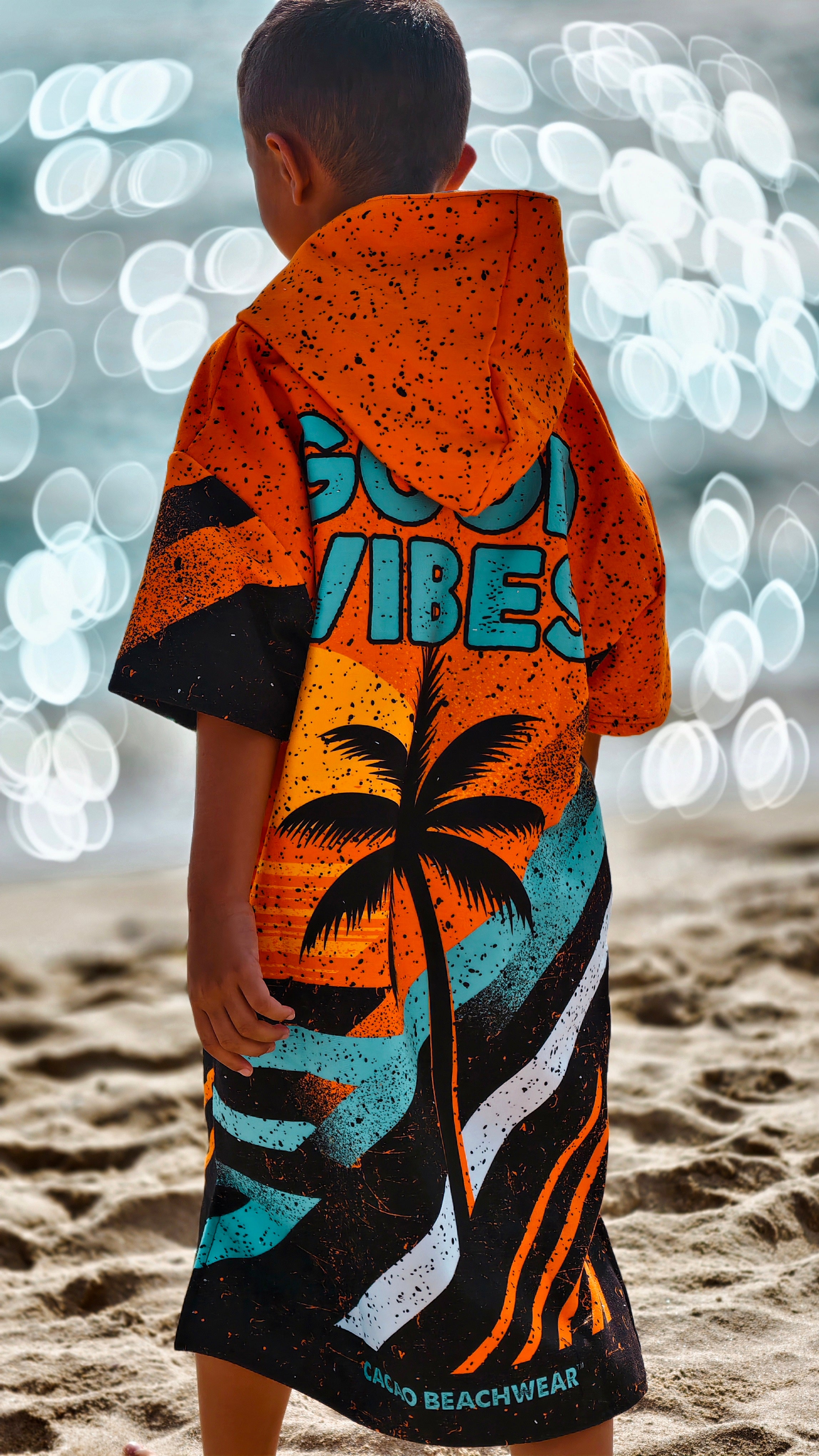 Orange children’s beach poncho towel for boys with hood, zipper and pockets – CACAO Beachwear™