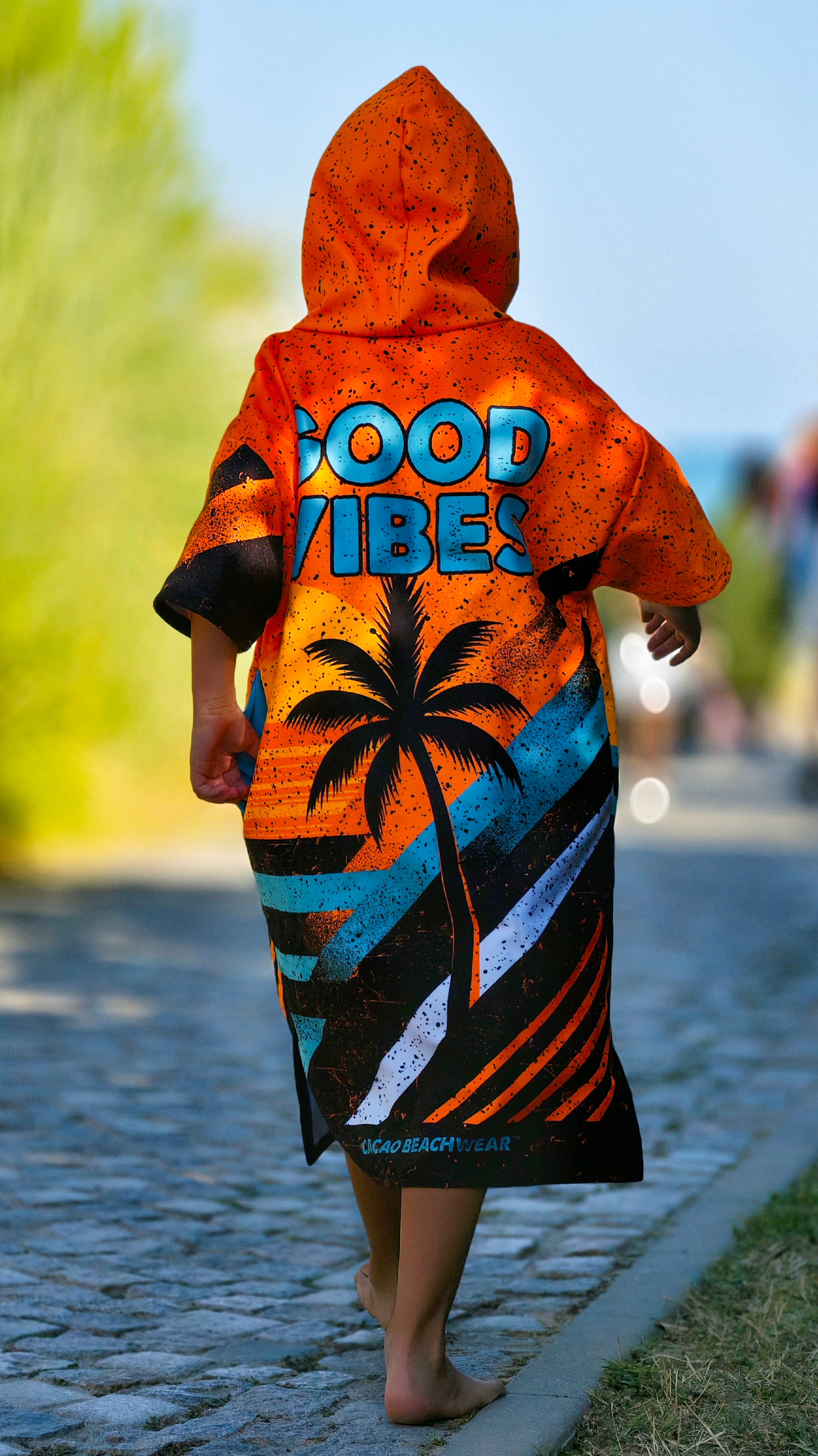 Orange children’s beach poncho towel for boys with hood, zipper and pockets – CACAO Beachwear™