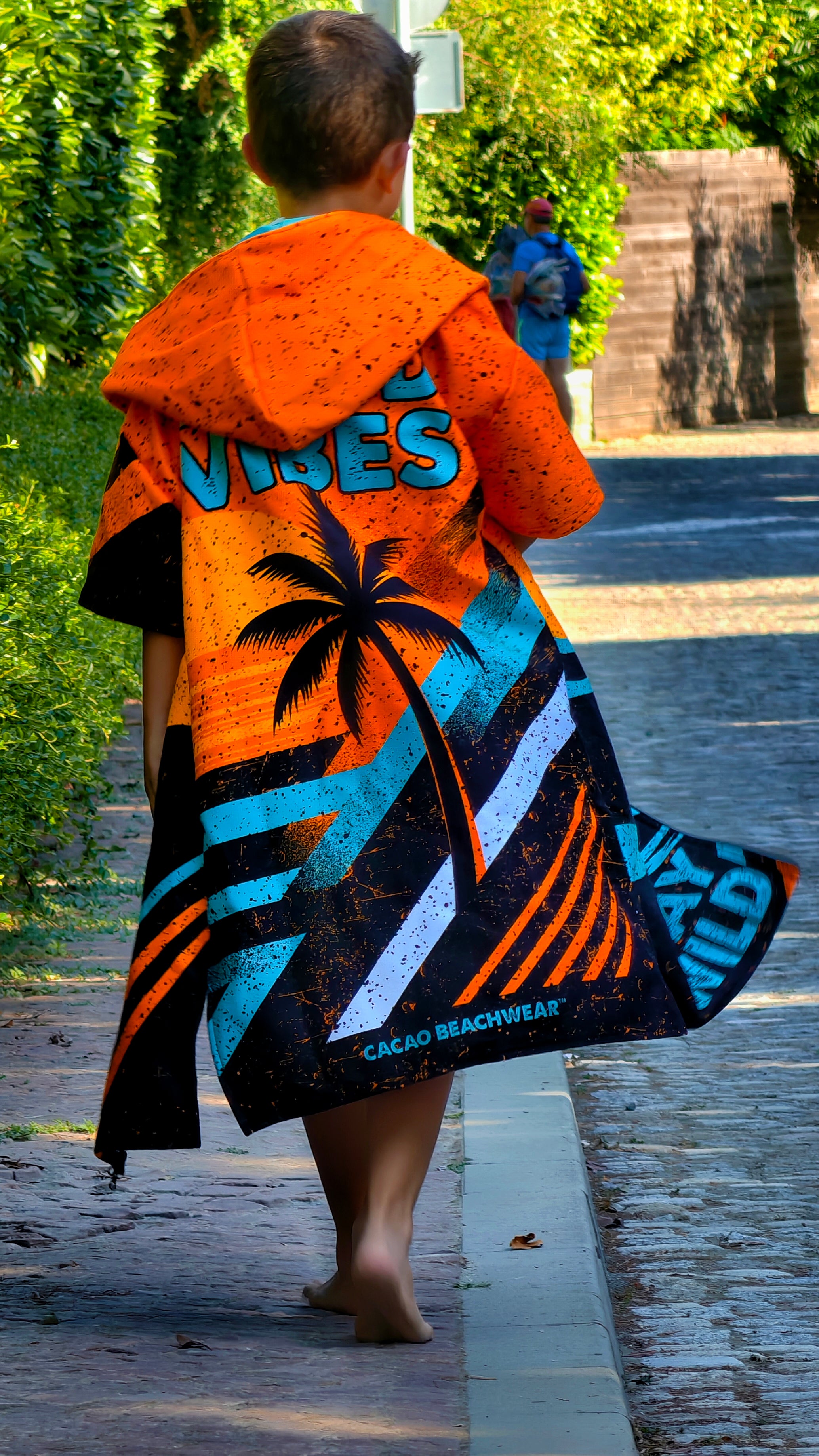 Orange children’s beach poncho towel for boys with hood, zipper and pockets – CACAO Beachwear™