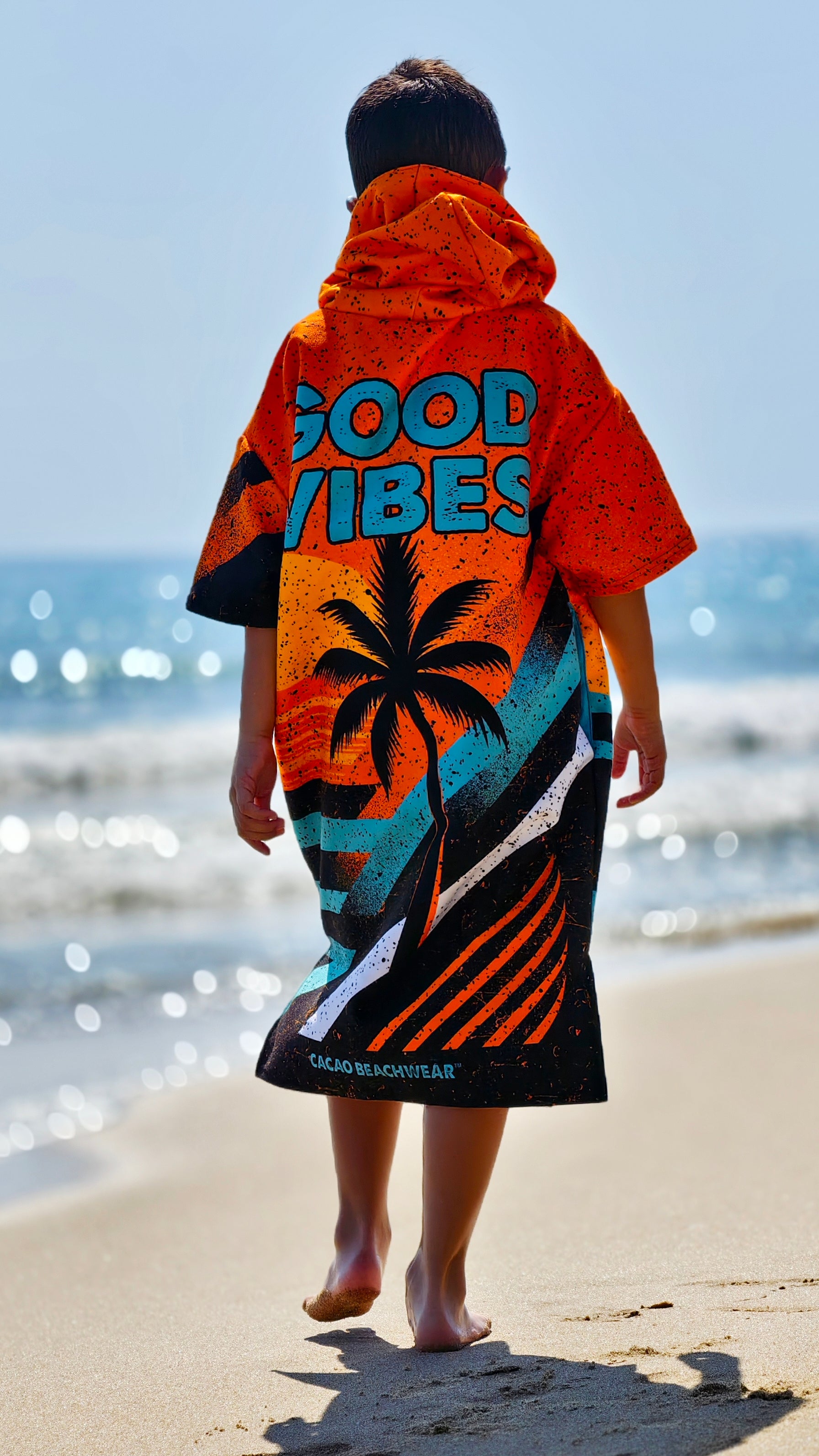 Orange children’s beach poncho towel for boys with hood, zipper and pockets – CACAO Beachwear™