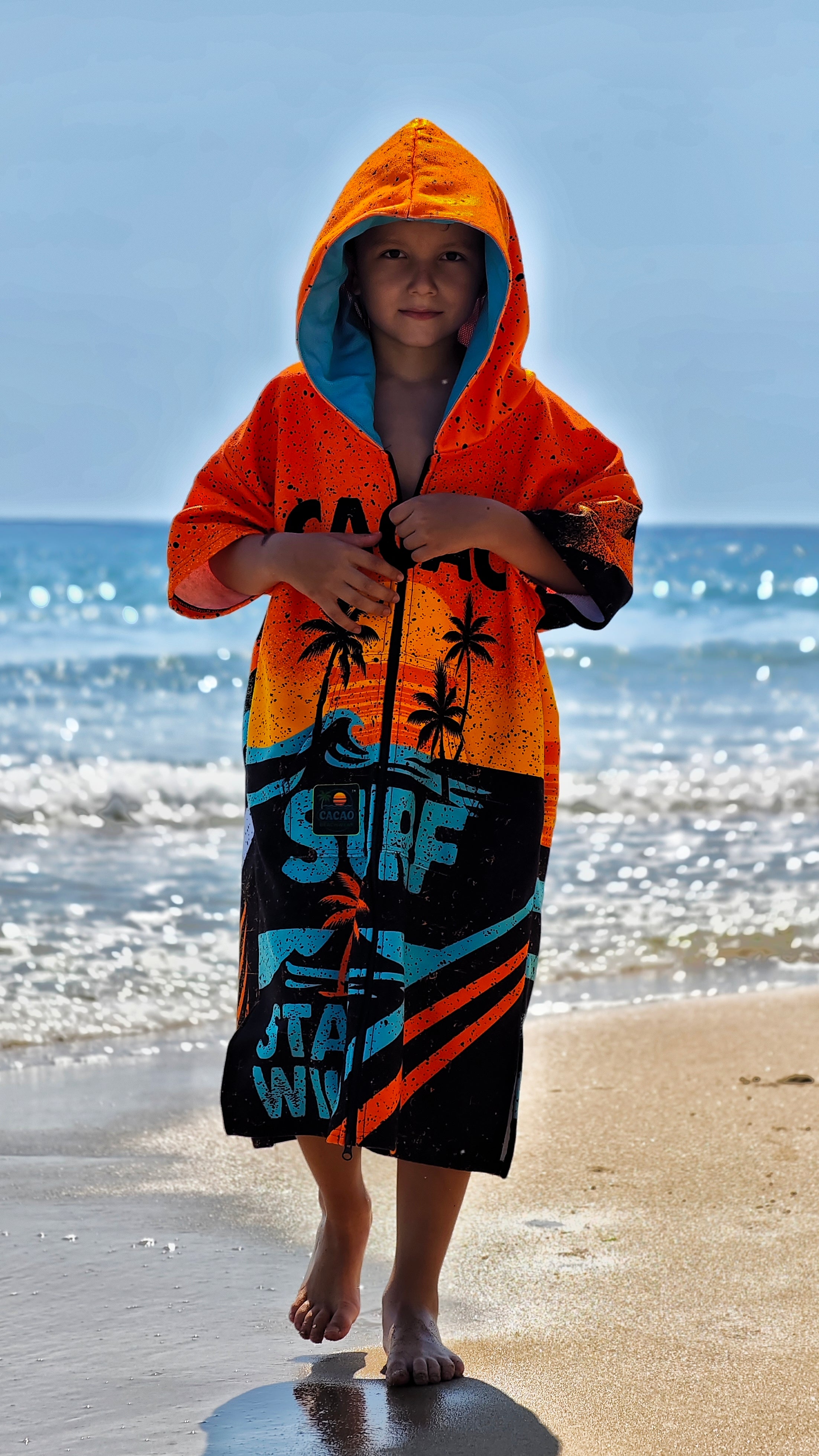 Orange children’s beach poncho towel for boys with hood, zipper and pockets – CACAO Beachwear™